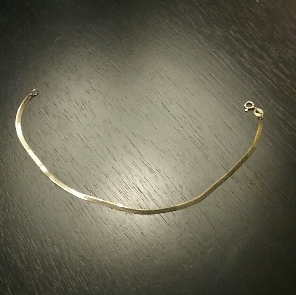 14kt gold herring bone bracelet.